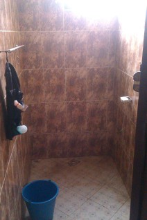 My bathing room. You can't see the shower head but you can see the tap and bucket I use.